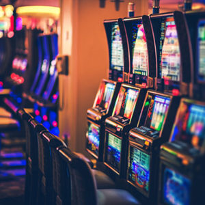 Rows of Casino Slot Machines with Shallow Depth of Field. Las Vegas Gambling Theme.